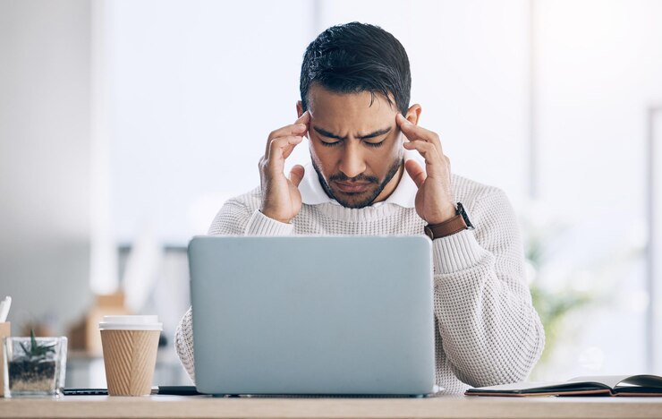 Photo work stress and burnout man at computer reading spam email glitch or 404 error in office headache frustrated at work on tax compliance and businessman with problem on startup audit report online