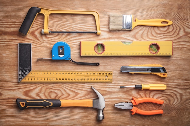 Work tools on wooden table.