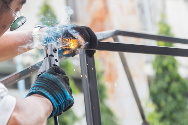 Photo work of the welder in the subsidiary farm