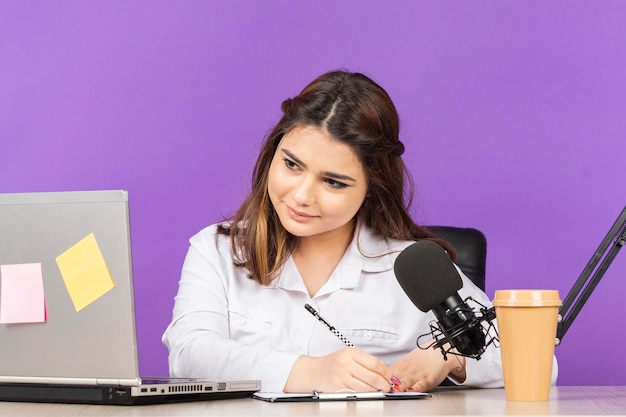 Workaholic young girl taking her notes High quality photo