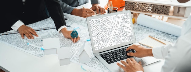 Worker architect and engineer work on real estate construction project oratory planning with cartography and cadastral map of urban town area to guide to construction developer business plan of city