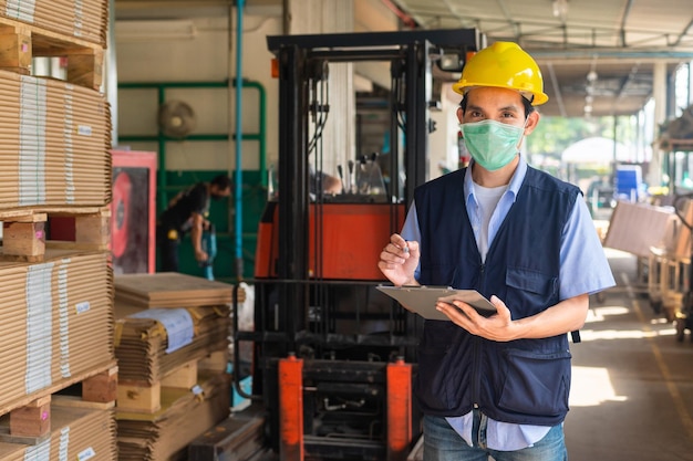 Worker checking raw material in store for factory industrial, Safety Engineer