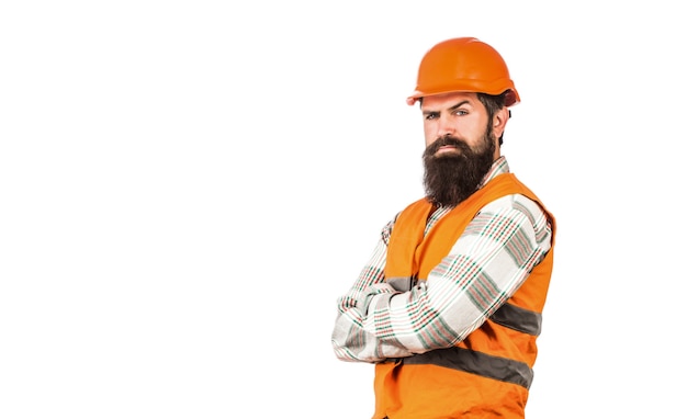 Worker in construction uniform. Architect builder. Bearded man worker with beard in building helmet or hard hat.