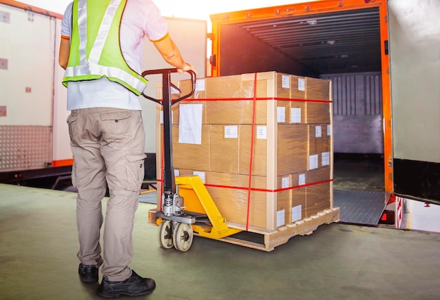 Worker courier unloading package boxes into cargo container\
loading dock warehouse cargo shipping