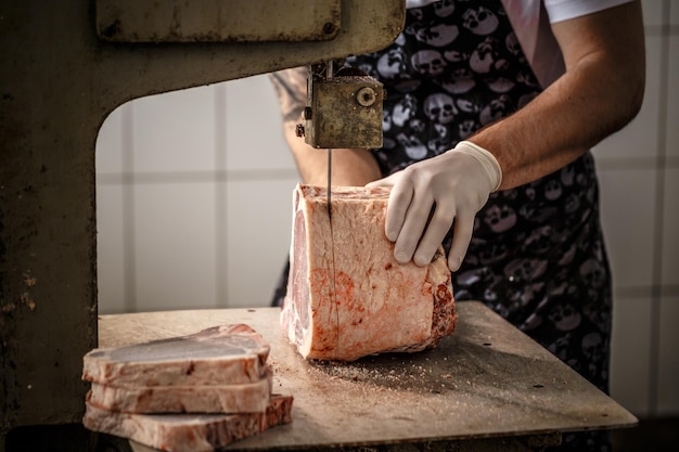 Worker cuts beef meat