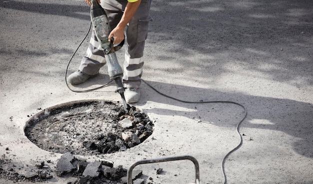 worker detail plan with jackhammer