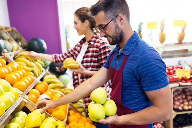 Worker in grocery store.