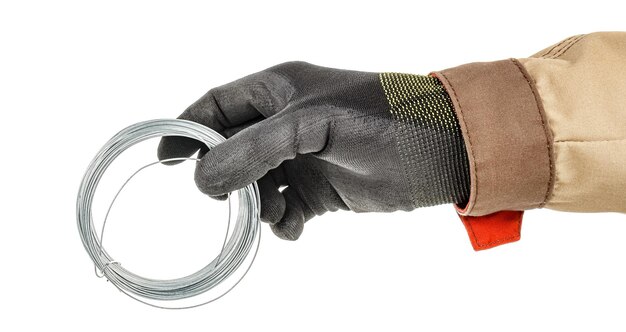 Photo worker hand in black protective glove holds steel wire coil isolated on white