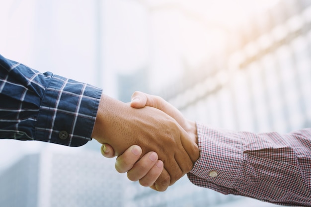 worker hand shake between two business man