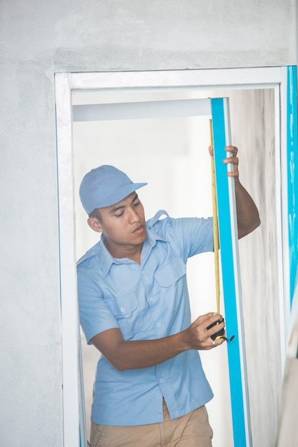 Worker installing doors