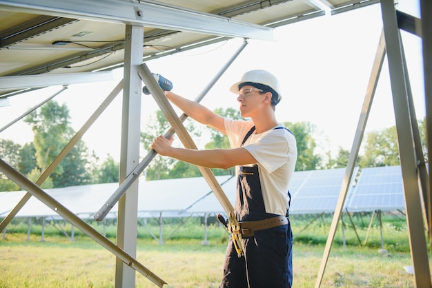 Worker installing solar panels outdoors