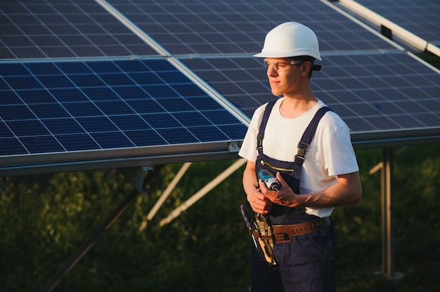 Worker installing solar panels outdoors