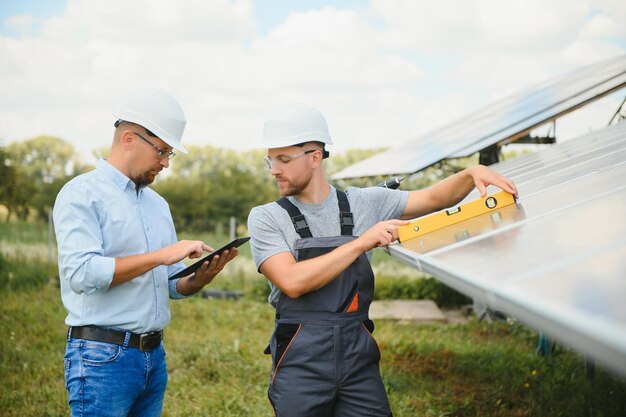 Worker installing solar panels outdoors