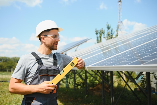 Worker installing solar panels outdoors