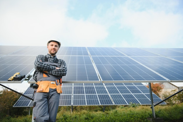 Worker installing solar panels outdoors