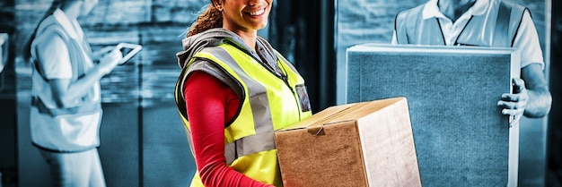 Worker is holding goods and smiling to the camera