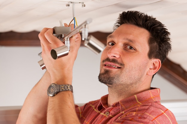 Worker is installing a luster