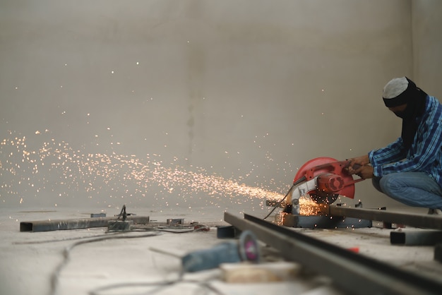 Worker labor cutting C line metal