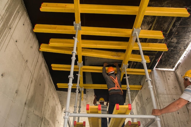 Worker laid scaffolding