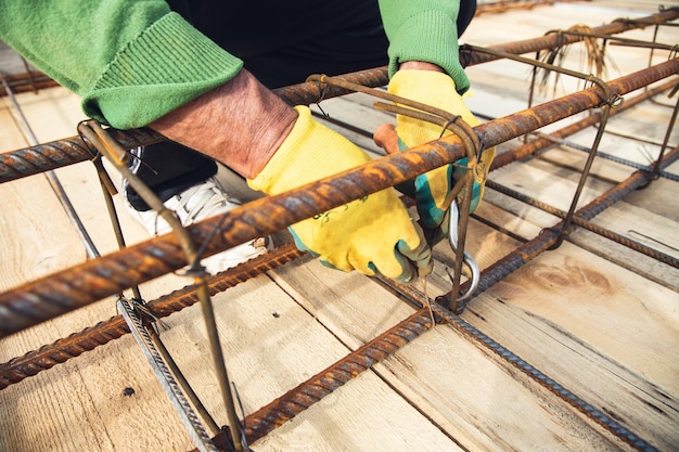 Worker making iron patterns in roof