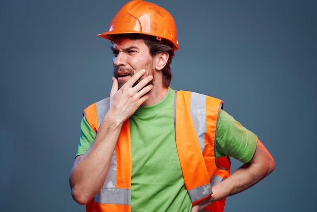 Worker man orange hard hat safety Professional blue background