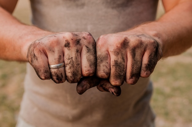 Worker Man with Dirty Hands.