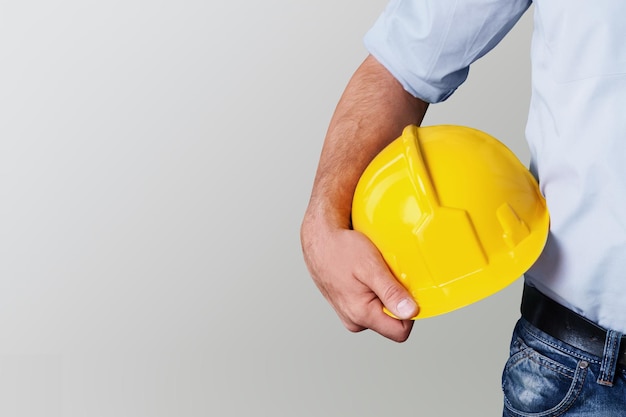 Worker man with helmet on background