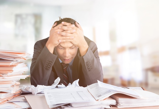 Worker overwhelmed executive working in the office