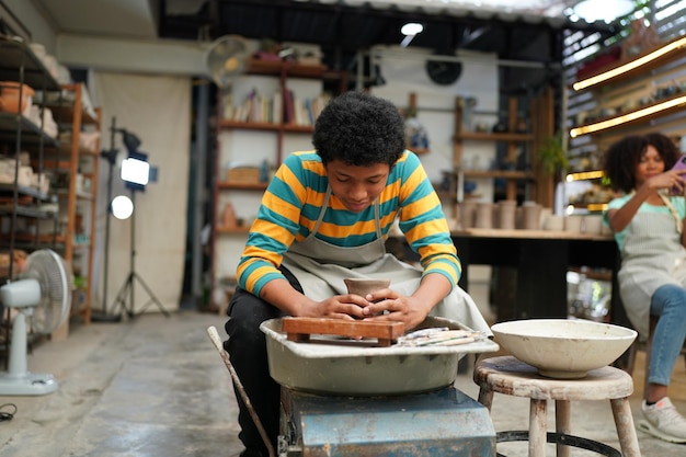 Worker at the pottery manufacturing