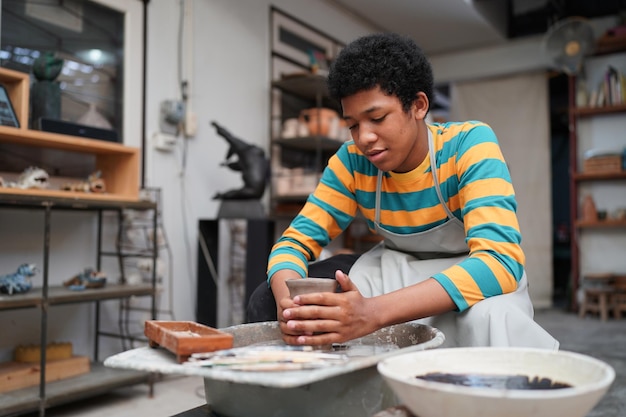 Worker at the pottery manufacturing