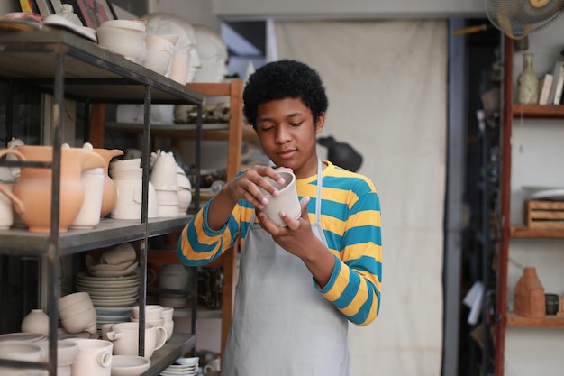 Worker at the pottery manufacturing