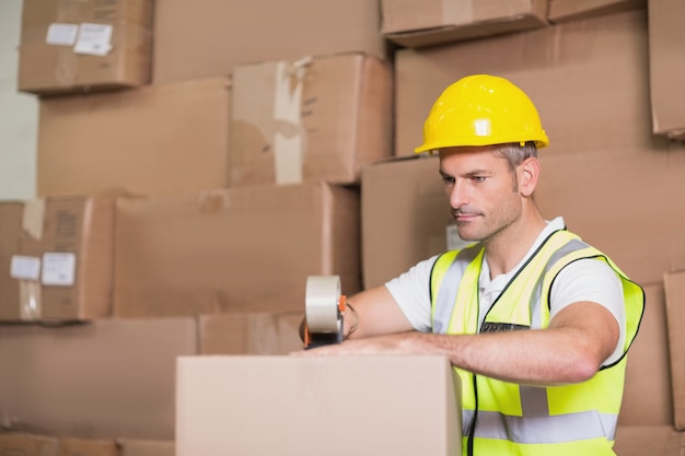 Worker preparing goods for dispatch