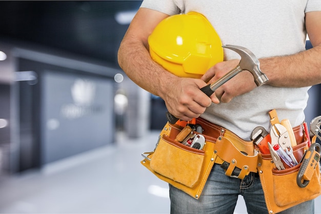 Worker and professional builder with tools