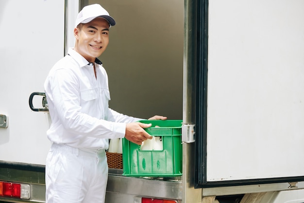 Worker Ready To Deliver Milk