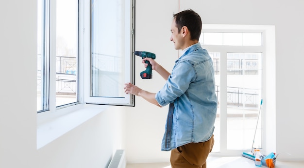 Worker setting up a window