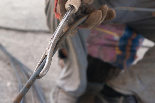 The worker straightens rebar