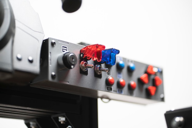 A worker turning on the toggle switch up industrial power control panel