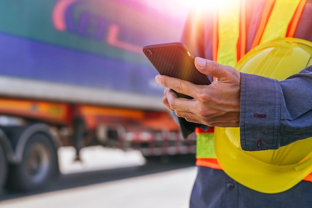 Photo worker use smartphones to check export items and truck transport export cargo background