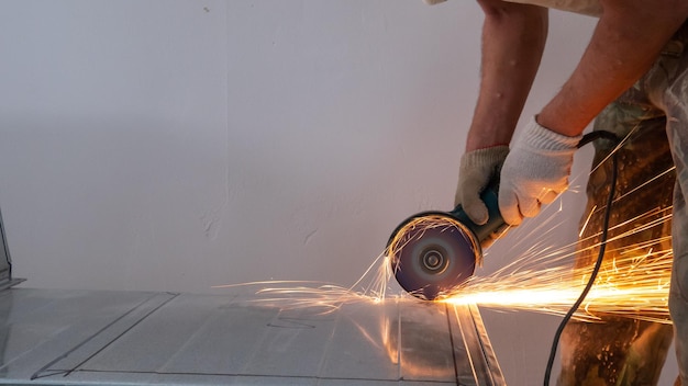 worker using an angle grinder