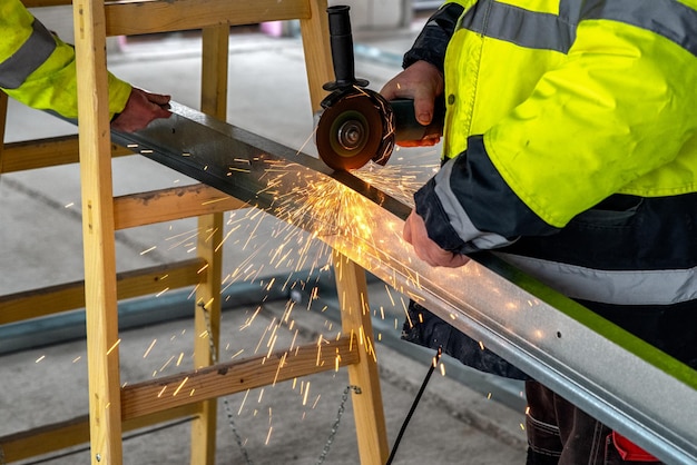 Worker using grinding machine