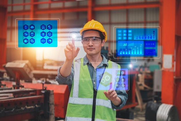 Worker using technology visual screen checking system safety\
before working in production factory