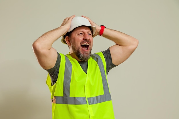 Worker in a vest and white helmet