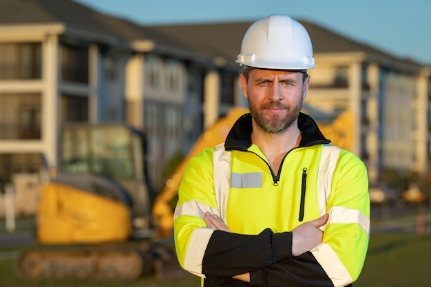 Worker with bulldozer on the building construction