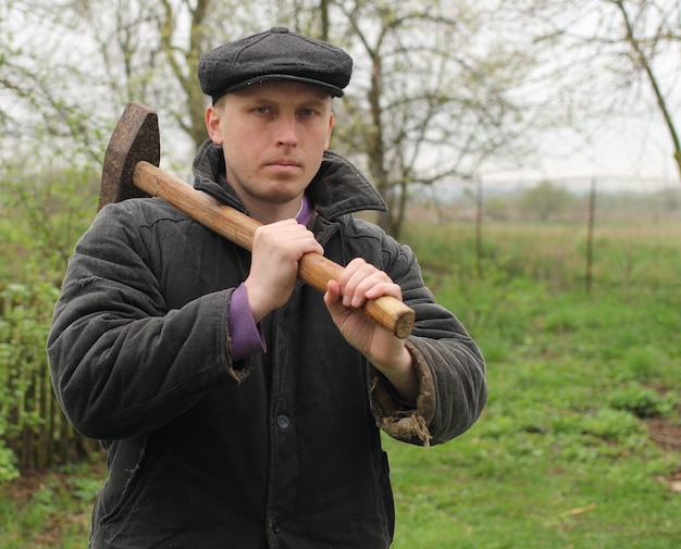 Worker with hammer in hands