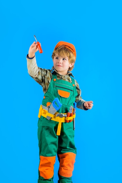 Worker with tools repair little boy in builder uniform with tools belt little kid repairman builder