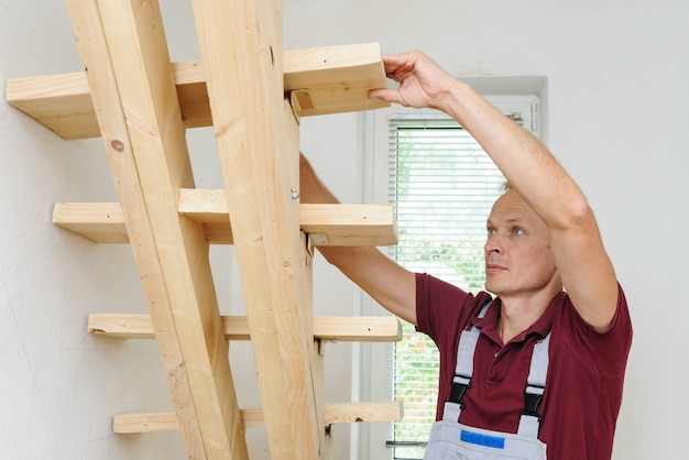 The worker and wooden stairs.