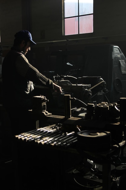 worker working on lathe