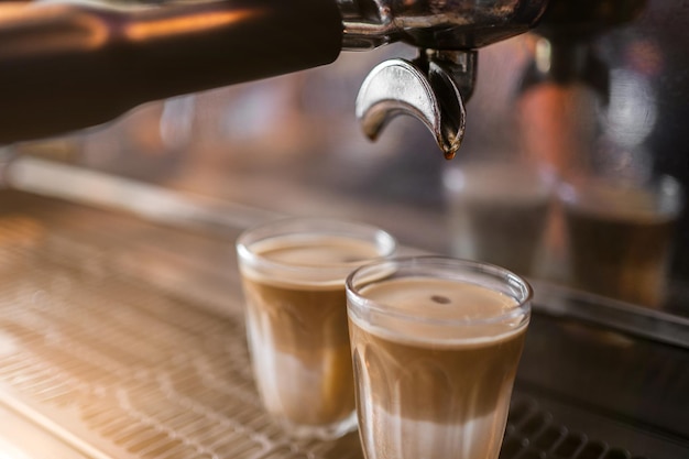 Worker works with a coffee machine