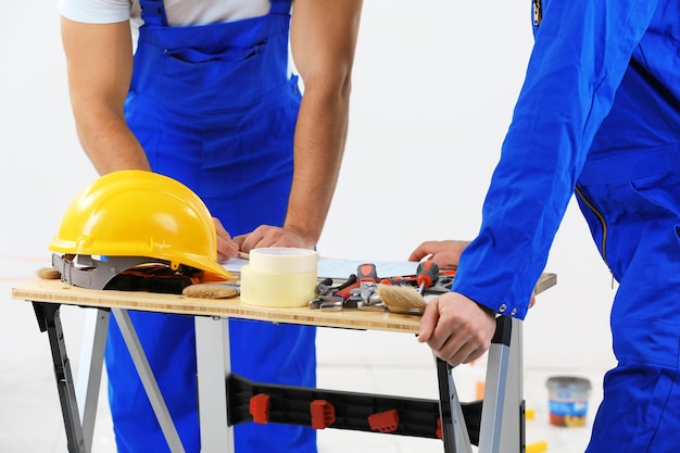 Workers in apartment closeup