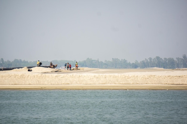 Workers are working on the banks of the river Padma The picture was taken from Manikganj Dhaka in the summer View of the river Padma in Bangladesh